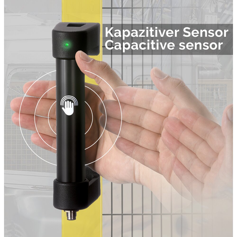 Black capacitive handle with a green LED indicator mounted on a yellow structure, with a hand approaching it and text indicating 'Kapazitiver Sensor Capacitive sensor'