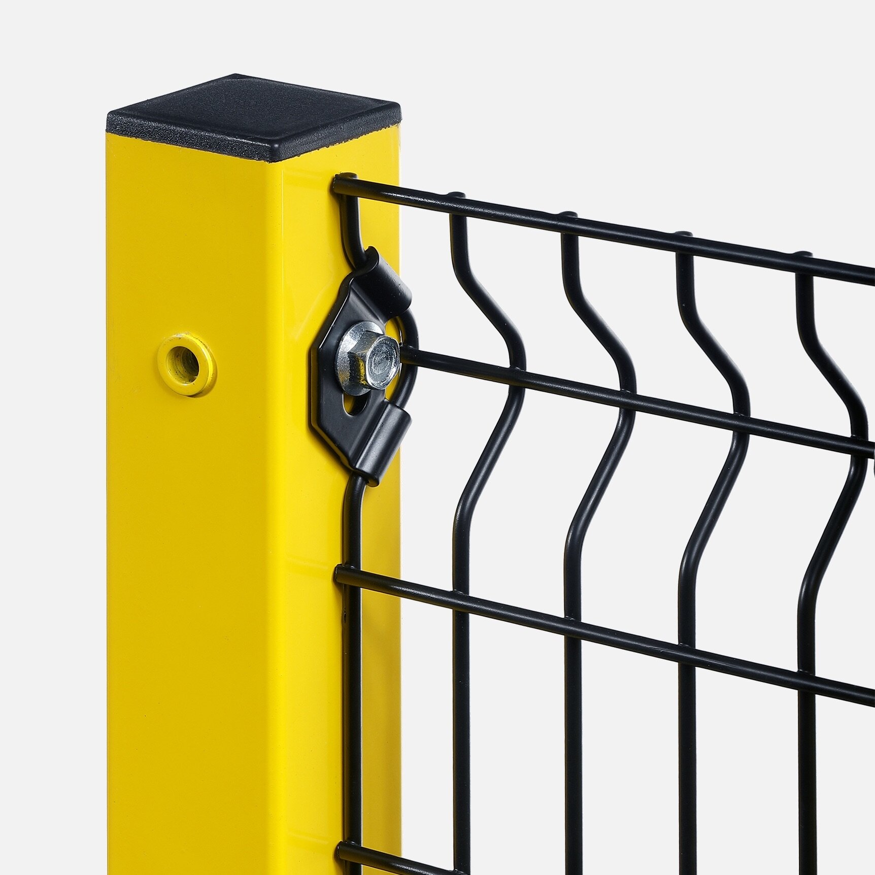 Close-up of yellow metal fence post with black wire mesh panel attached by metal bolt and bracket