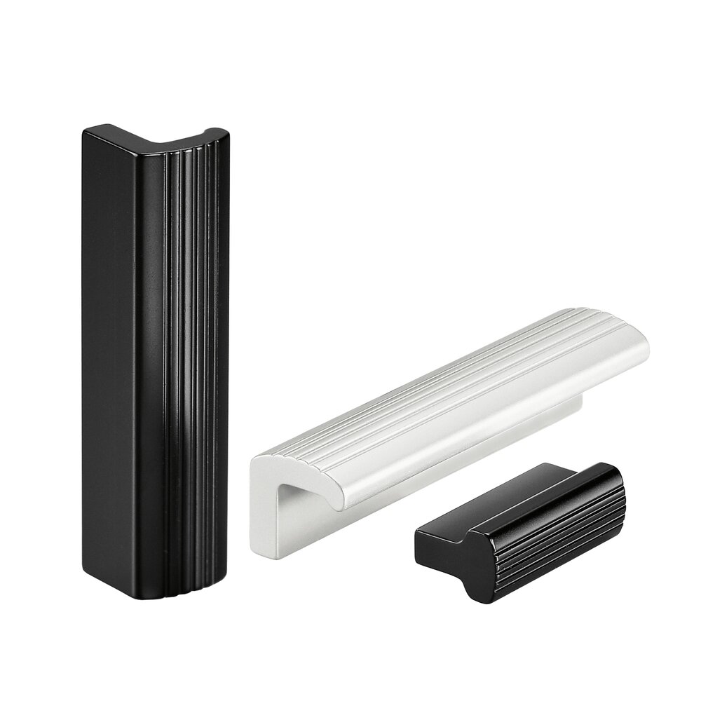 Three aluminum profile handles, two black and one silver, with ribbed grip textures on a white background