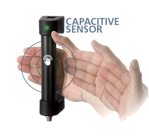 Black cylindrical handle with green LED indicating capacitive sensor, hand positioned near handle with concentric blue circles illustrating sensing function