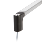 Close-up of a black polymer handle corner with a metallic push button and translucent grey handle ledge with an attached grey cable