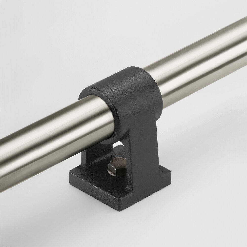 Black polyamide mounting bracket securing a stainless steel tubular handle horizontally on a white background