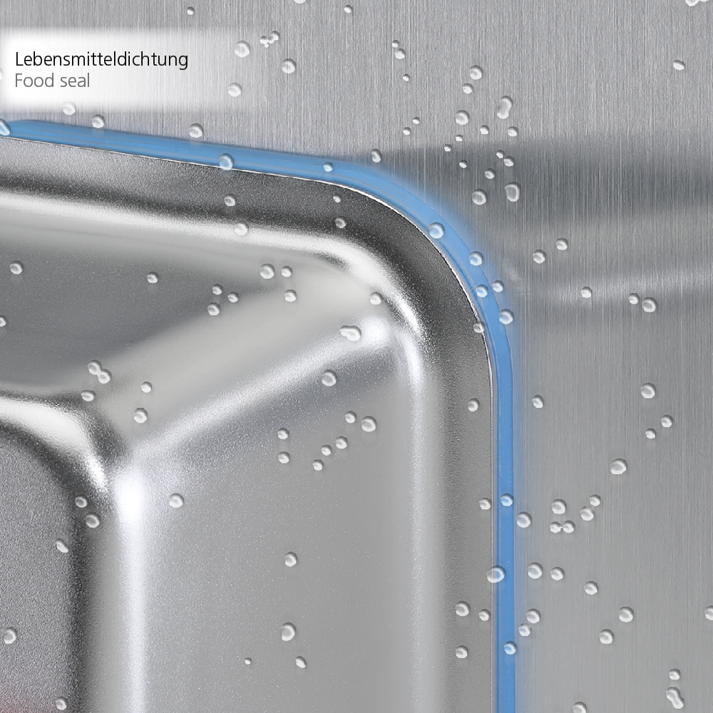 Close-up view of a corner of a stainless steel switch housing with a blue food-safe polymer seal and water droplets on the surface, labeled with 'Lebensmitteldichtung Food seal'