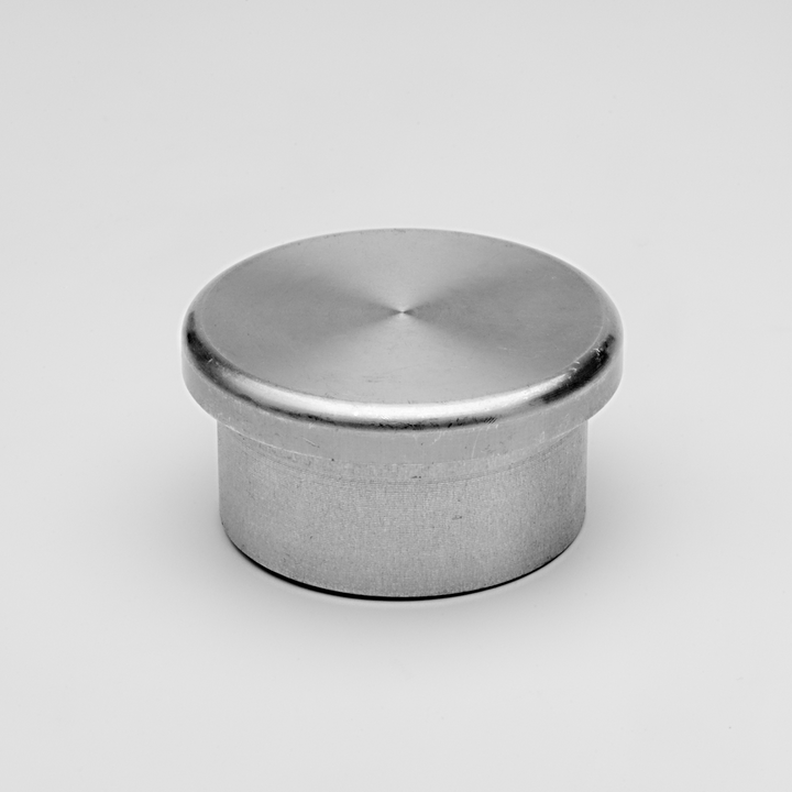 Aluminum cylindrical tube end cap with a smooth domed top isolated on white background