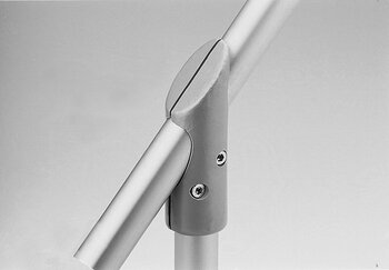 Metallic T-shaped tube connector joining three cylindrical tubes with two visible screws.