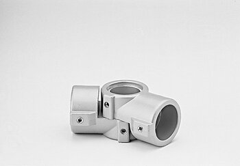 Metallic cross-joint tube connector with four perpendicular cylindrical openings and securing screws on a white background